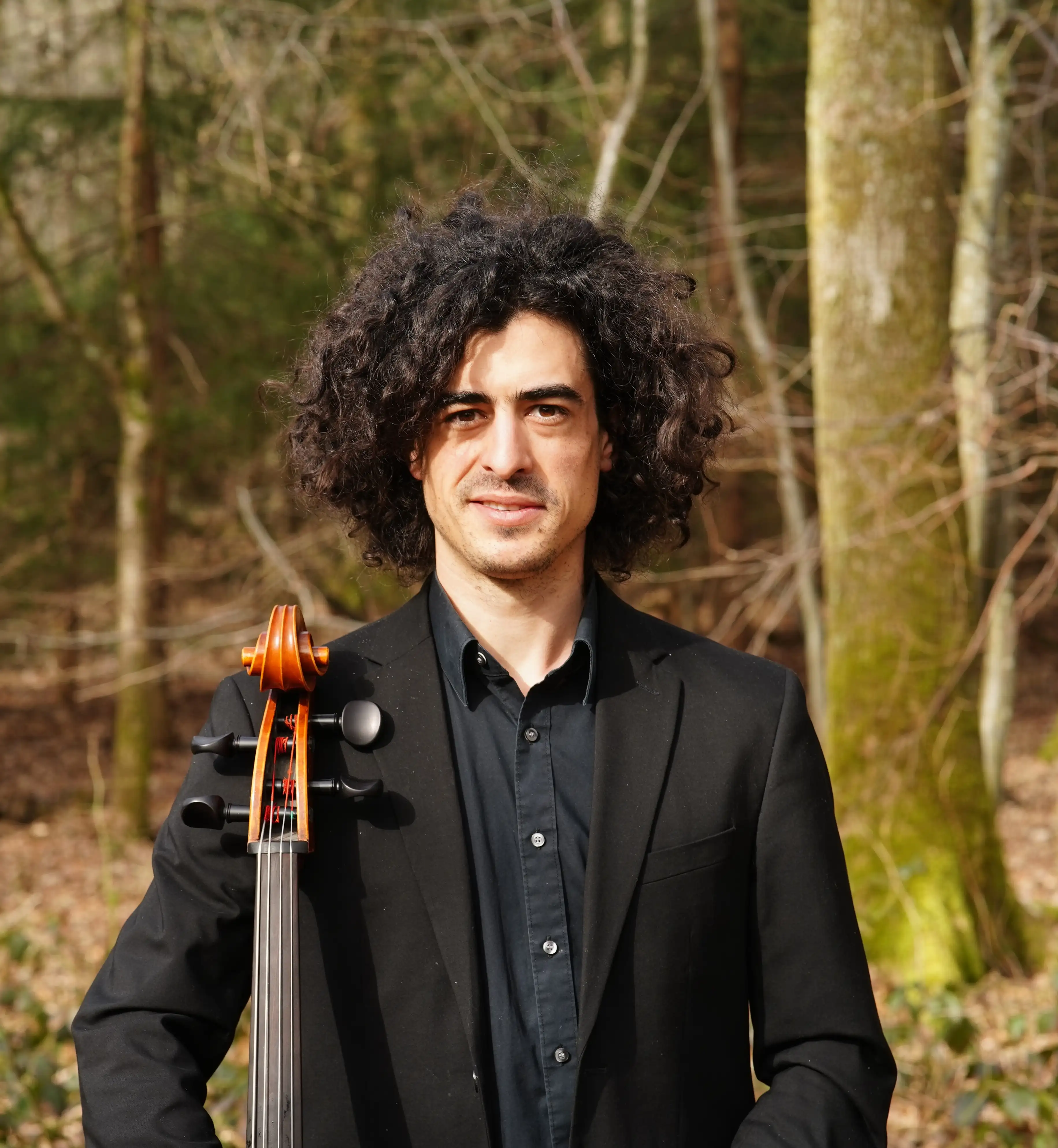 Gabriel teaching cello lessons